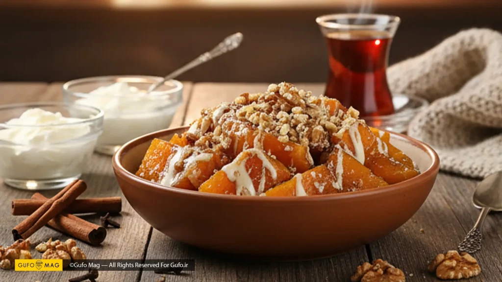 دسر کدو حلوایی پخته شده با گردو و خامه و ارده سرو شده در کنار چای