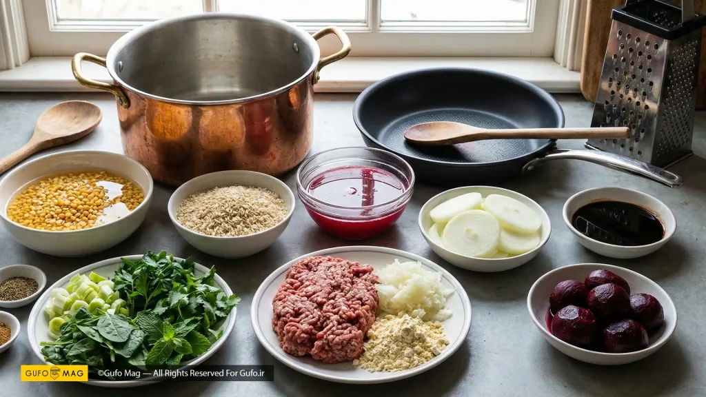 مواد اولیه تازه آش انار شامل انار، سبزیجات و گوشت روی میز آشپزخانه